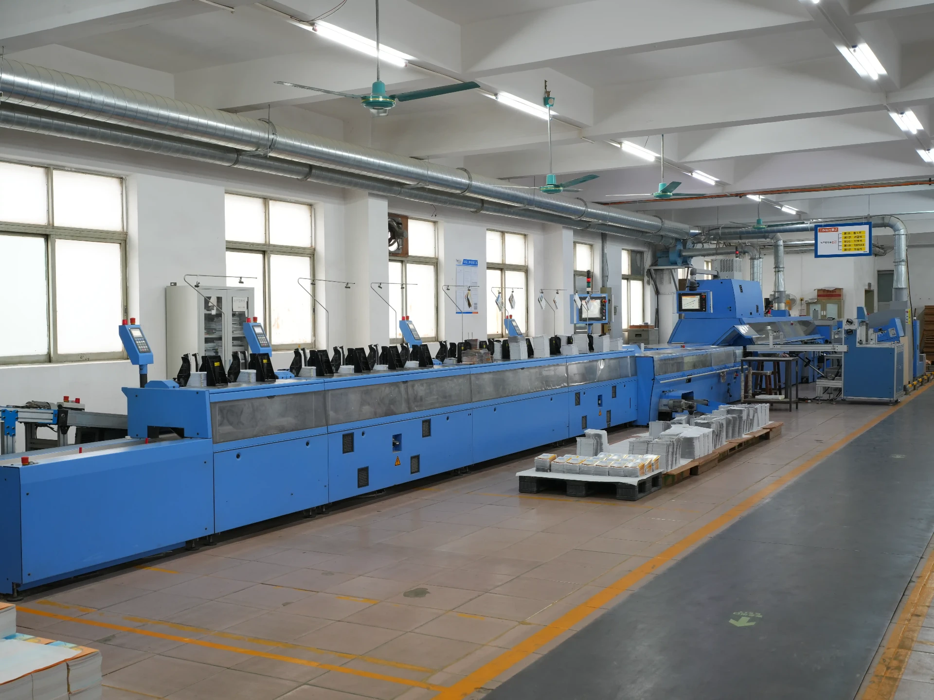 Dalang, Dongguan. The coil line and the bindery share a wall. Dalang, Dongguan. The coil line and the bindery share a wall.